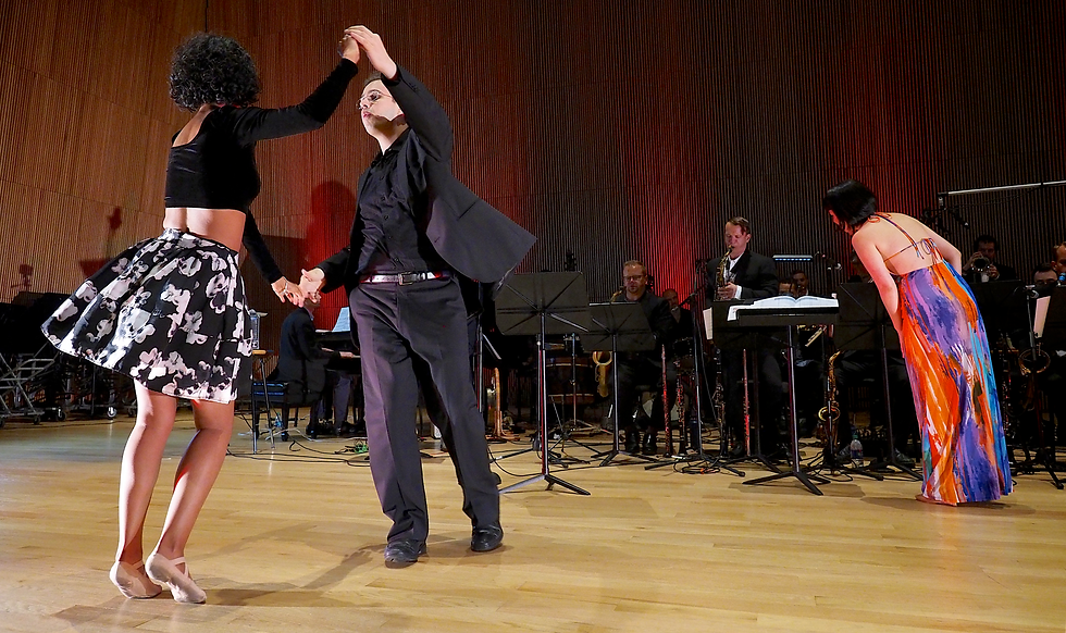 Rafael Piccolotto de Lima dancing forró with Sabrina Evangelista while the big band continues performing under the direction of Migiwa Miyajima.