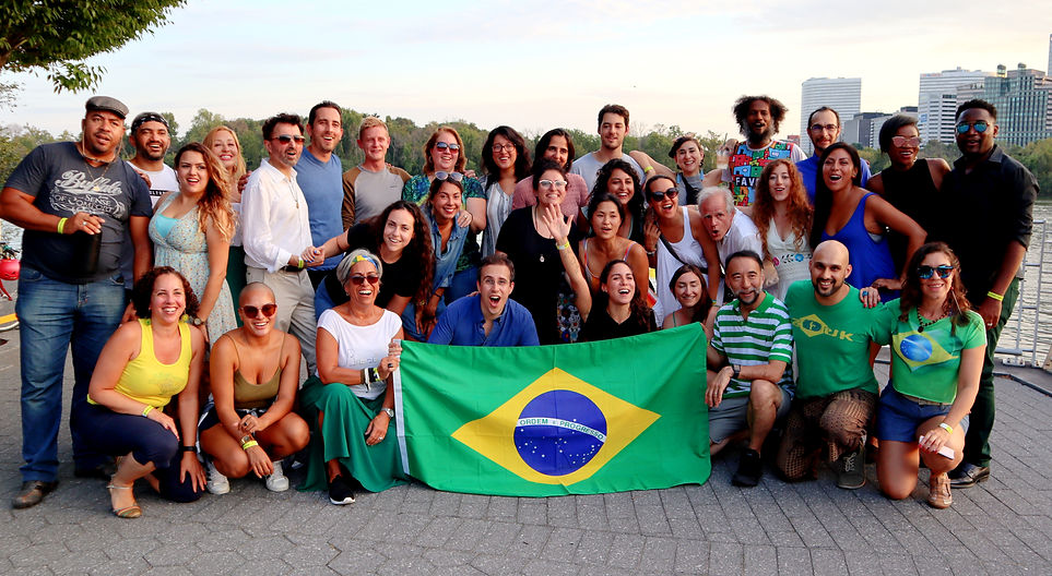 Participants gathered outdoors at sunset after the final activity of Rafael and Camila Alves’ 2019 forró collaboration in Washington, D.C.