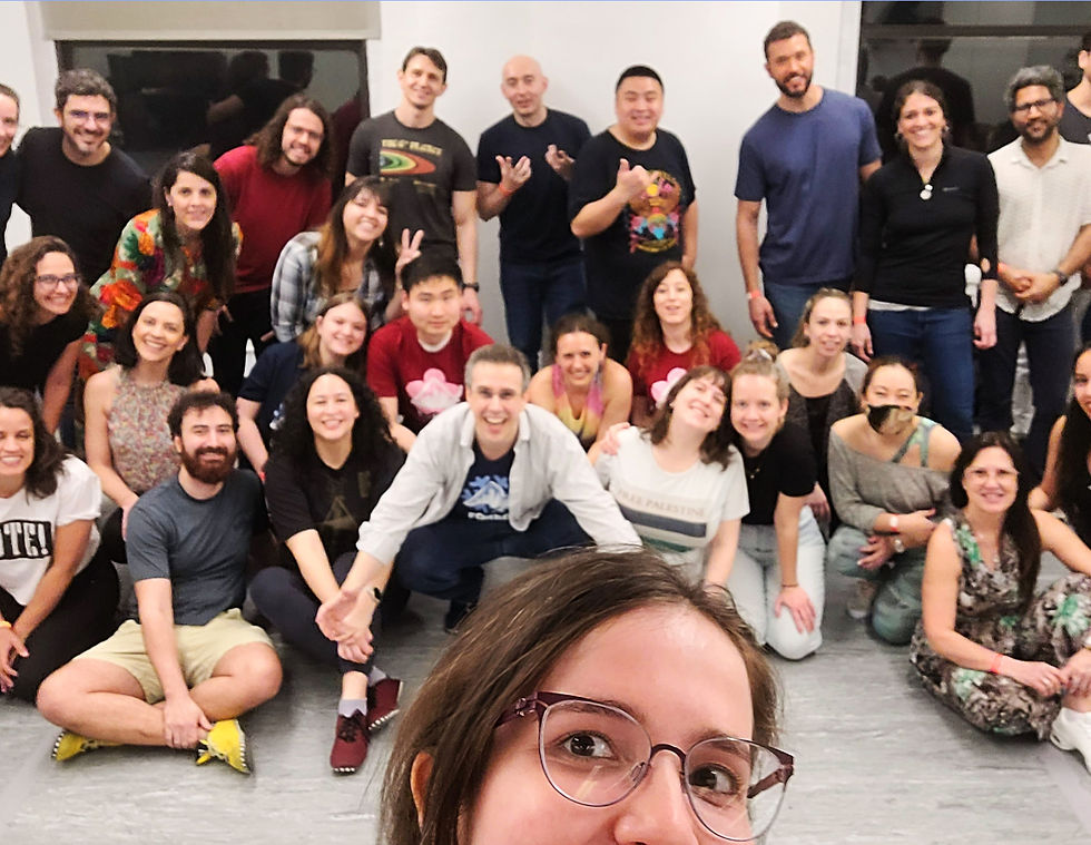 Teaching assistant and volunteer taking a group selfie with students gathered together during Forró New York Weekend Winter 2024 in New York City.