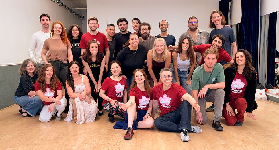 Participants pose for a group photo at the end of a workshop with Rafael and guest instructor Camila during the Forró New York Weekend Spring Edition 2026. The photo was taken in a dance studio in Midtown Manhattan, with several participants wearing festival shirts.