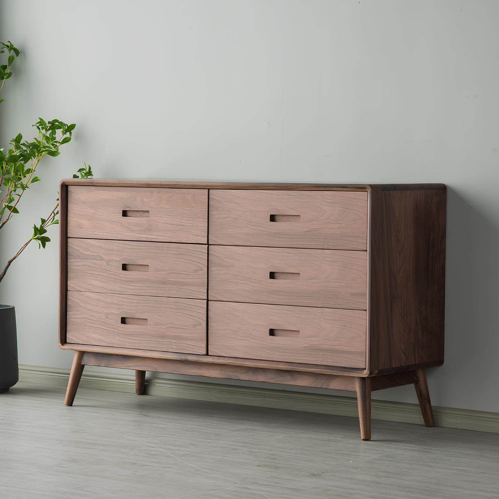 Walnut chest of drawers in room