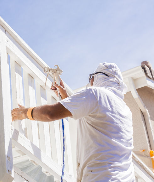 house-painter-spray-painting-a-deck-of-a-home-2024-09-11-21-50-31-utc.jpg