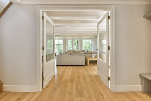 a-view-of-a-living-room-from-a-hallway-2025-02-10-05-33-44-utc.jpg