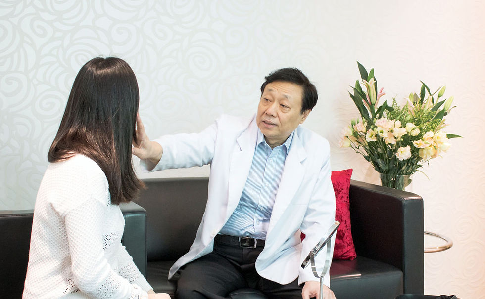 A woman consults with laser specialist, Dr Francis Tjang