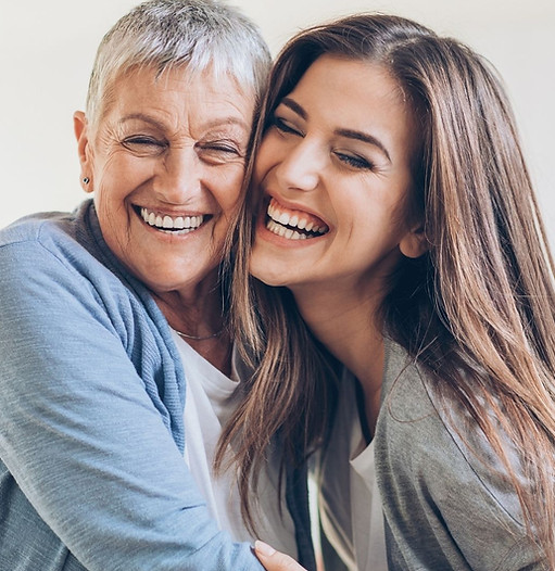 mother and daughter smiling