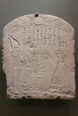 Reproduction stone stela from Abydos made in c. 747-656 BC which enabled votive offerings to be given to the deceased spirit of a woman called Inamun Nayesnebu.