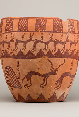 Reproduction of a Naqada II period pottery jar showing a herd of antelope in the mountainous valleys of Egypt.