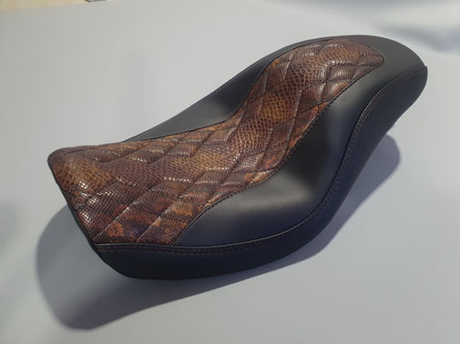 Harley Davidson seat in black marine vinyl sides and brown snakeskin vinyl insert with a diamond stitch.
