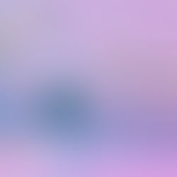 Abstract image of intertwined iridescent tubes and discs against a pink and purple gradient background, creating a futuristic vibe. No text.