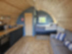 Looking into the lodge and seeing kitchen, bed and sofa
