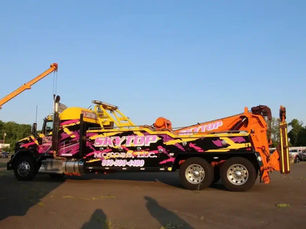 Skytop Towing & Recovery LLC tow truck providing 24/7 towing and recovery services in Connecticut. Image shows professional light duty, medium duty, and heavy duty tow trucks assisting cars, trucks, and semi-trucks after breakdowns and accidents. Scene highlights emergency towing, accident recovery, roadside assistance, and flatbed towing services near me, representing a trusted towing company CT serving drivers day and night.