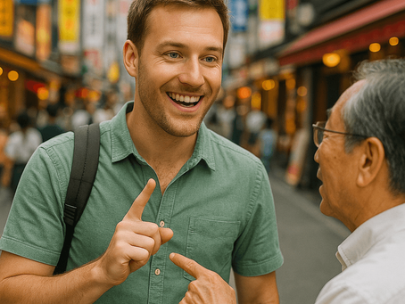 Two people converse happily in a vibrant street with colorful signs. One wears a green shirt and backpack, the other gestures with a finger.