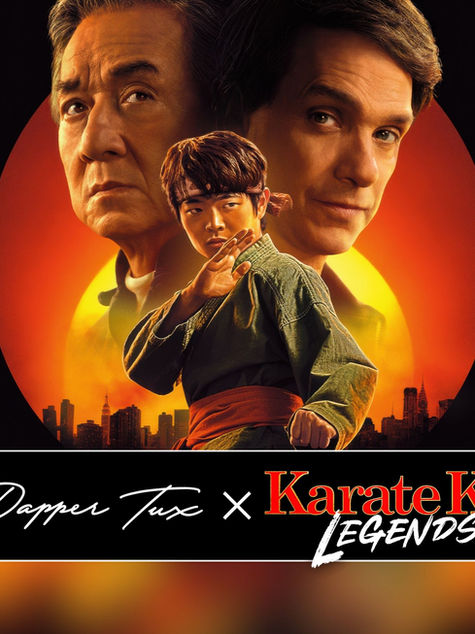 Karate Kid Legends movie banner featuring Ralph Macchio, Jackie Chan, and newcomer Ben Wang standing together at sunset with film title text overlay.