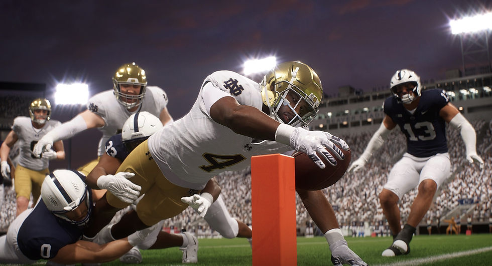 Football player in white and gold dives to score a touchdown, reaching over the goal line under stadium lights. Other players rush in.
