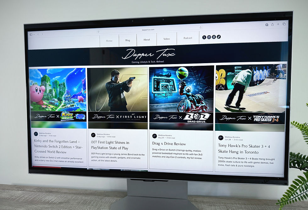 The Odyssey 3D Gaming Monitor screen displays a website titled "Dapper Tux" with gaming reviews, featuring colorful images from various games like Kirby and Tony Hawk's Pro Skater.