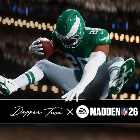 Madden NFL 26 screenshot with a football player in green and grey jumps, holding the ball mid-air in a stadium. Text: Dapper Tux x EA Sports Madden NFL 26.