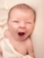 Yawning baby in newborn and family photography session