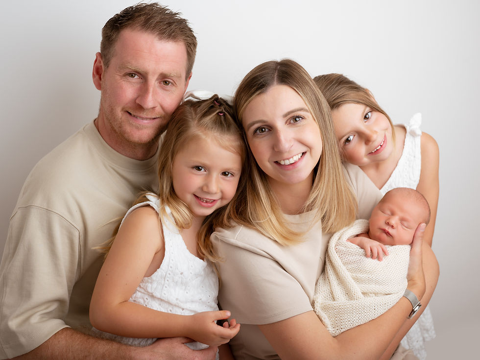 Newborn and family photography of parents with three kids