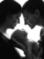 Silhouette of a newborn and family photography session.
