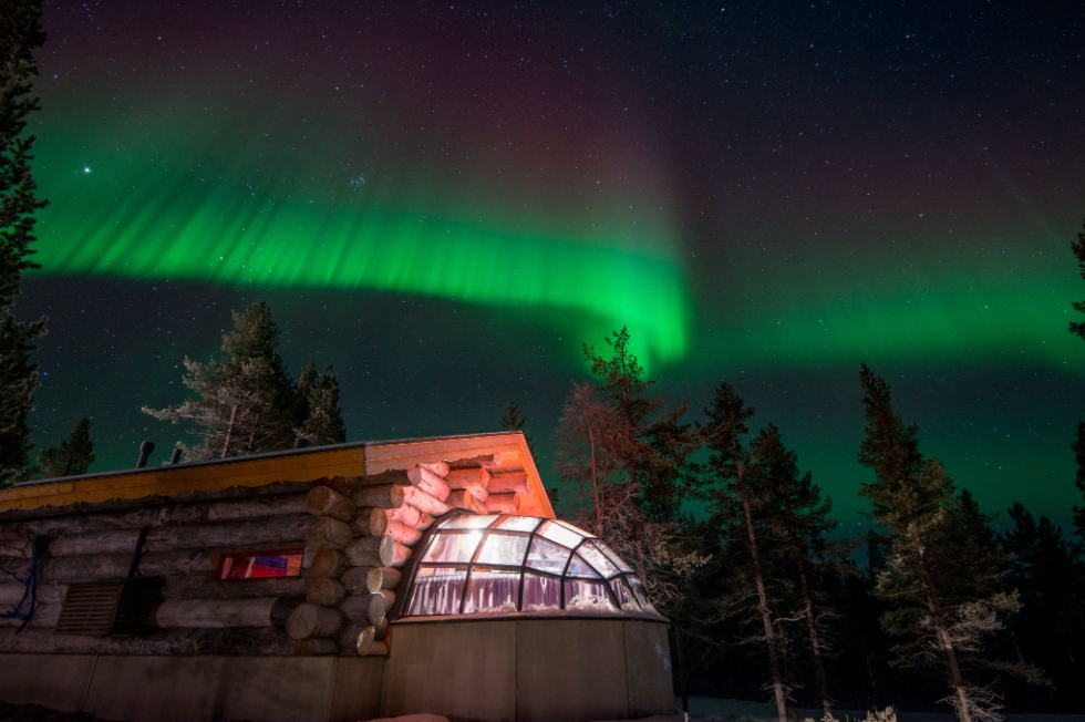 Northern Lights Over a Kelo Glass Igloo in Kakslauttanen Arctic Resort