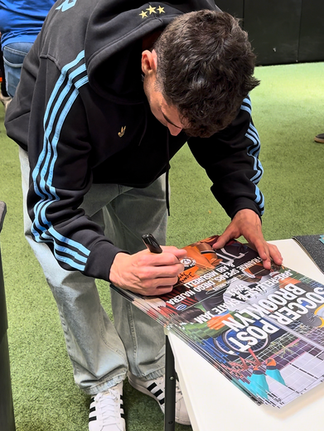 frankie spears signing posters at the connect skateboarding make your own skateboard workshop at soccer post brooklyn for the pre release event of the thrasher x afa x adidas collection