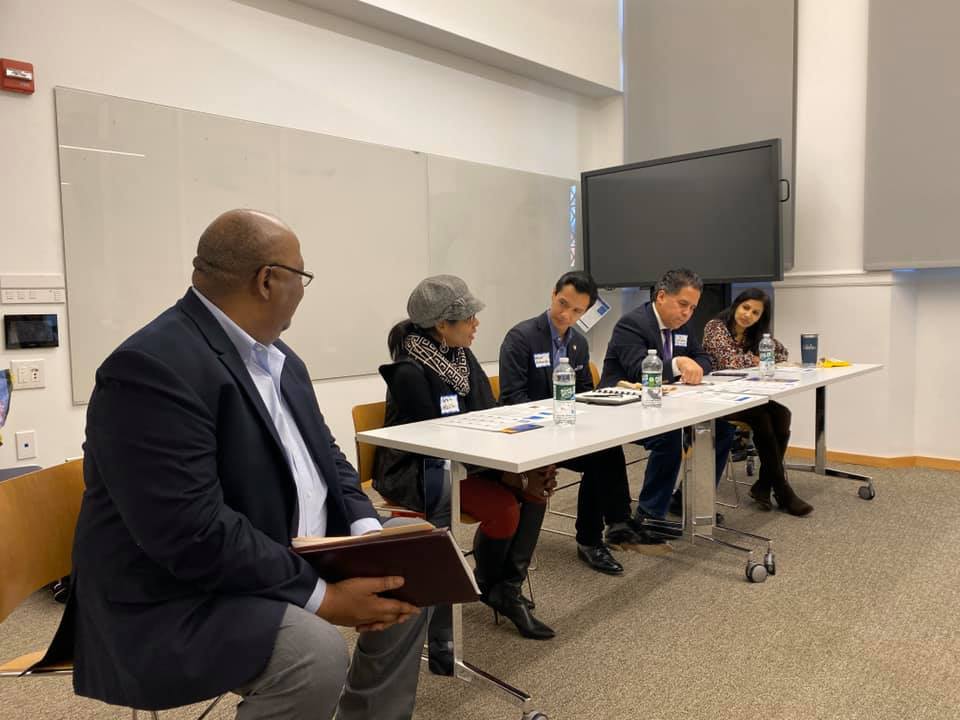Panelists seated at table