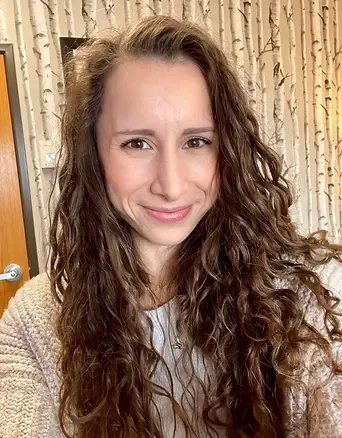 Portrait of Molly Harris, MSW, LCSW, CST, therapist at Evans Counseling Group specializing in individuals, couples, and families navigating eating disorders, identity exploration, sexuality, stigma, and life challenges.