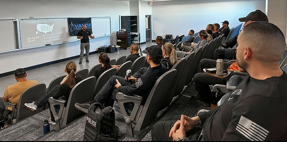 Class setting with people in chairs being taught by instructor.