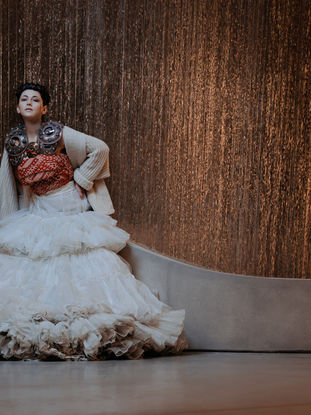 Latvian Folk dance photography by the layered glass wall "Motus"