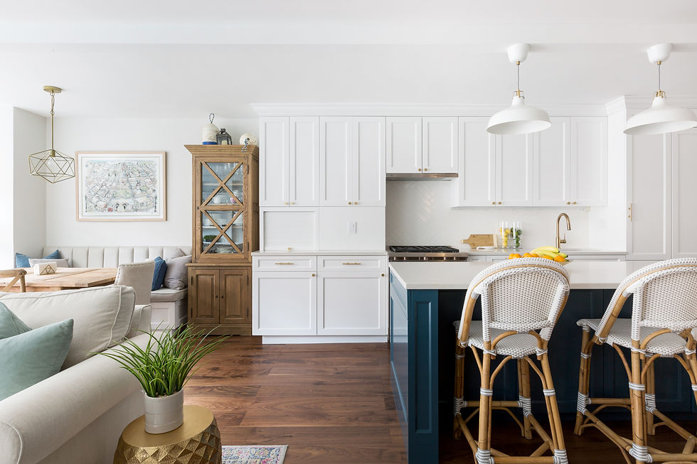 Organic modern kitchen and dining room with warm wood flooring and natural light.