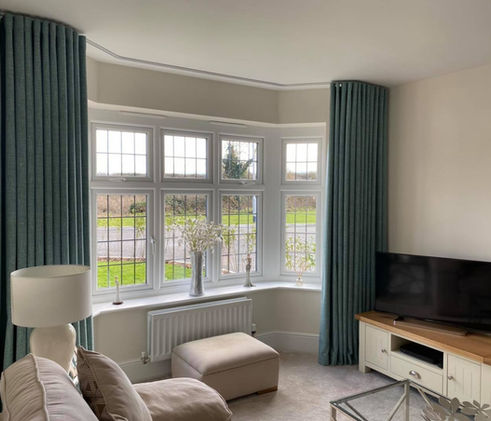 A lovely set of curtains in a Livingroom.