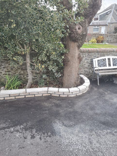 Stonework around a driveway.