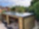 smart new fibreglass roof on substantial garden structure