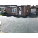 A lovely brand new driveway out side of a house.