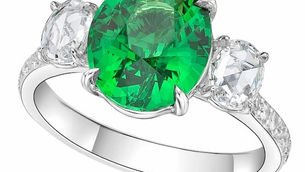 Custom tsavorite birthstone engagement ring in platinum setting by Caram