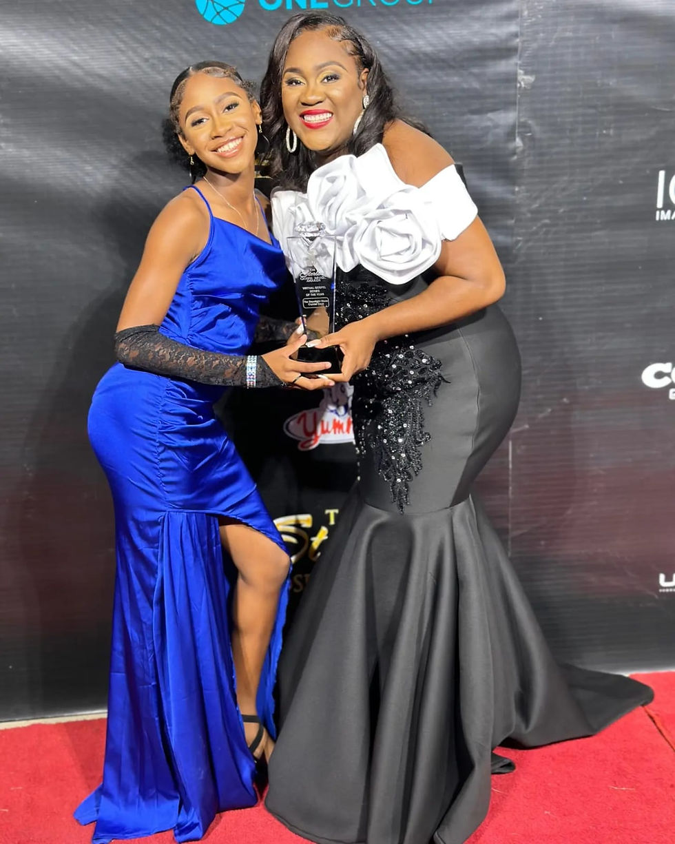 Crystal Daye poses with her daughter, Christelle, after winning the Sterling Award for Virtual Gospel Series of the Year for The DayeLight Show