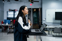 Student practicing public speaking during a leadership class.