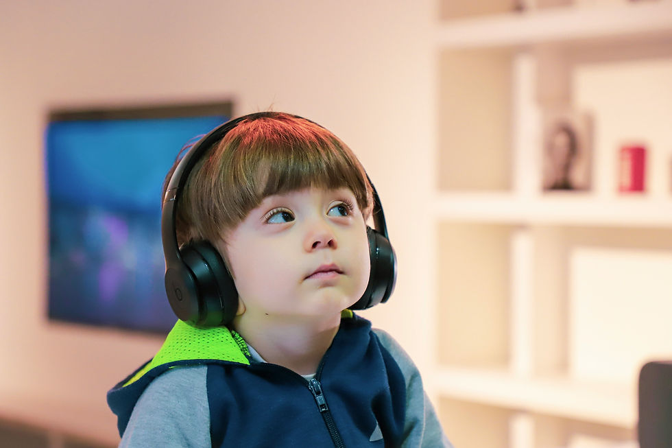 ASD Child with noise canceling headphones.