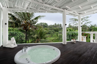 Outdoor jacuzzi terrace with jungle view at Villa Feliz Bali