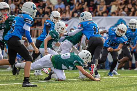 Football players in action on the field.