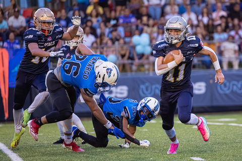 Football players in action on the field.