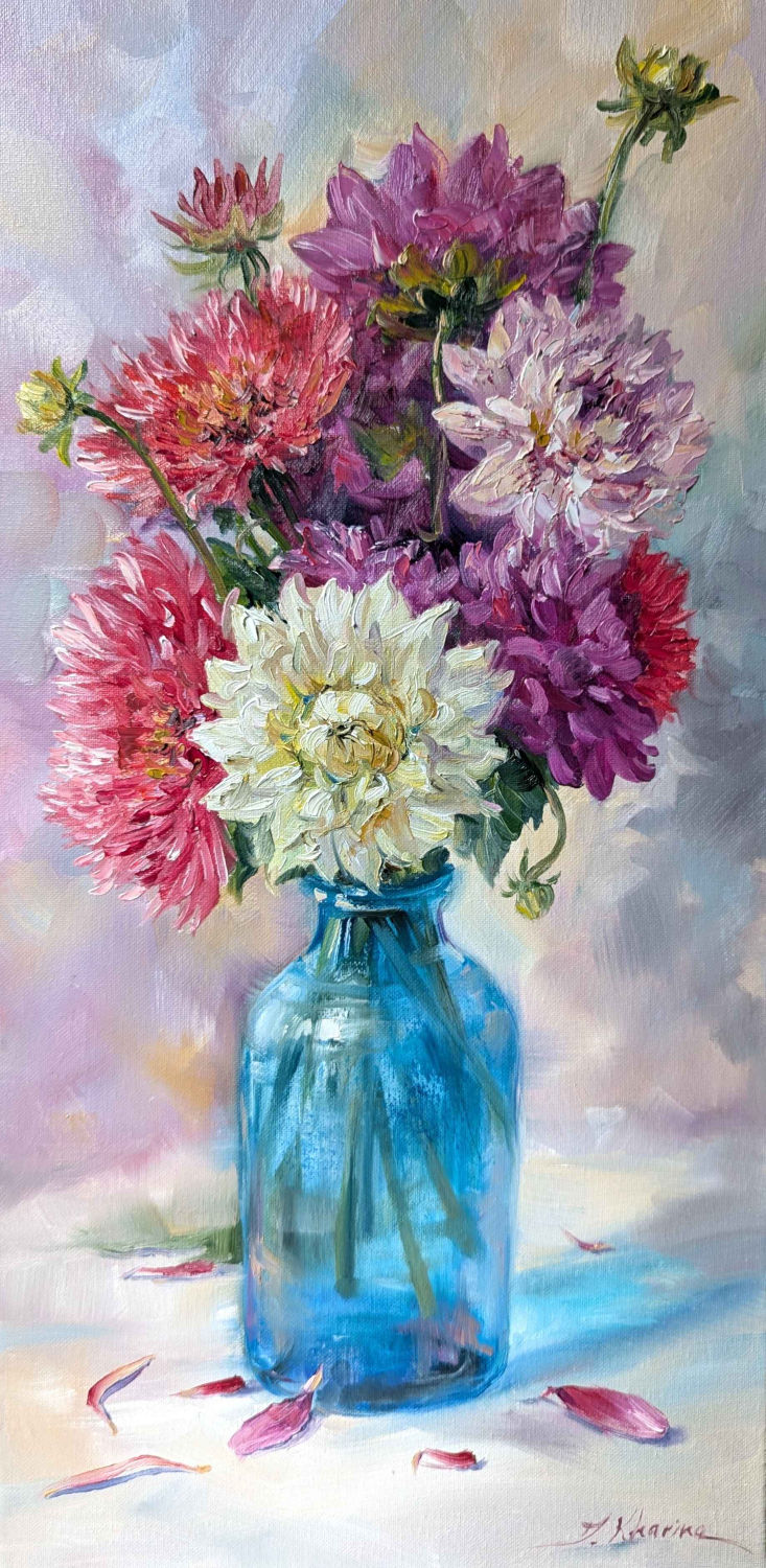 Dahlias in blue glass bottle
