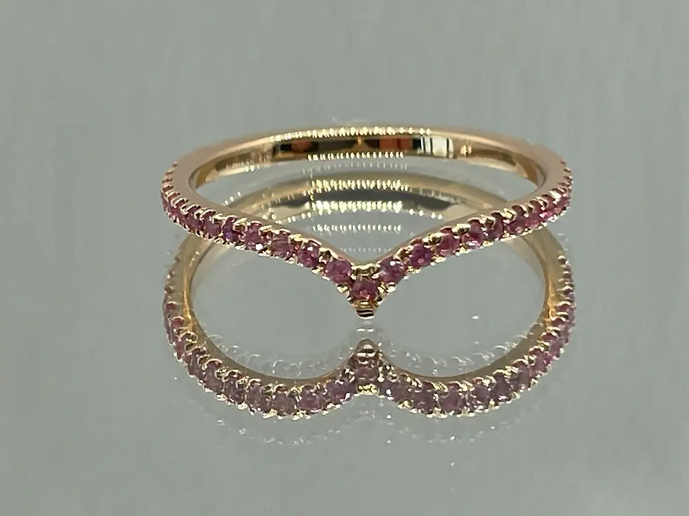 Custom 14K red gold ring with natural pink sapphires. Luxury handmade jewelry with expert gemstone setting.