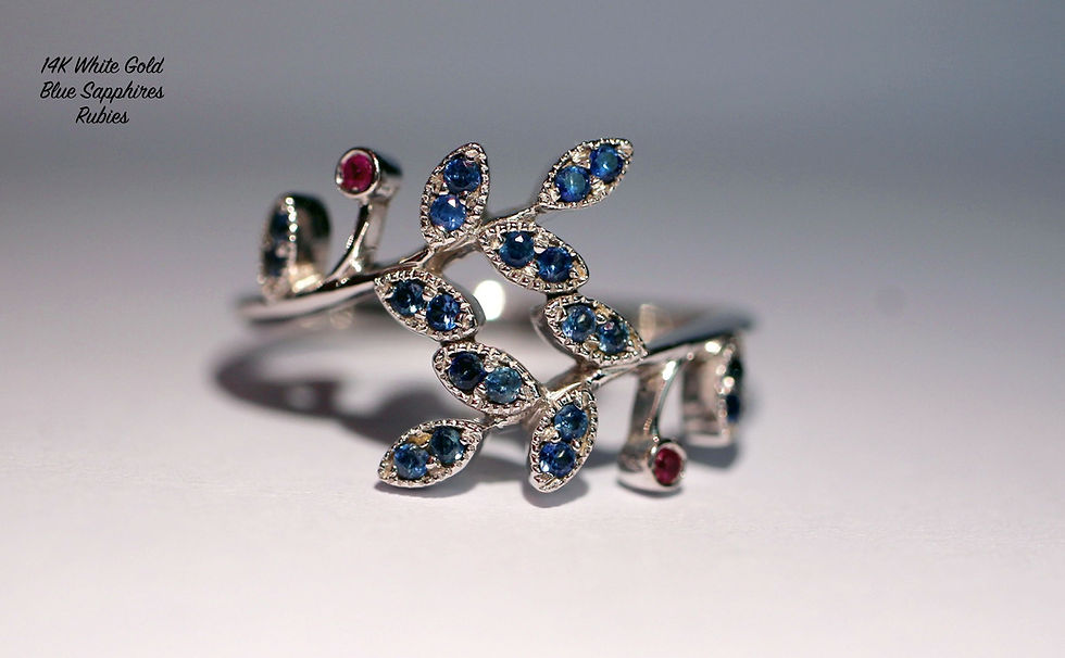 Thumbnail: Sapphire & Ruby Vine Ring in 14K white gold, designed as a delicate branch with sapphire leaves and ruby berries setting