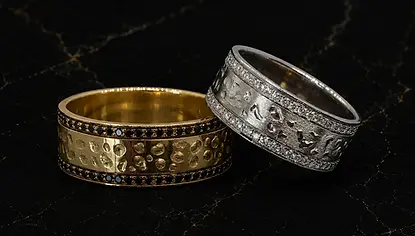 Custom engagement rings by Marchioness Jewelry Boutique in white and yellow gold, designer textured bands with black and white natural diamonds