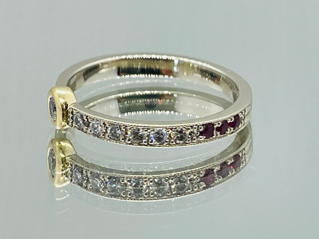 18K white and yellow gold engagement ring with diamonds and rubies, designer custom jewelry piece.
