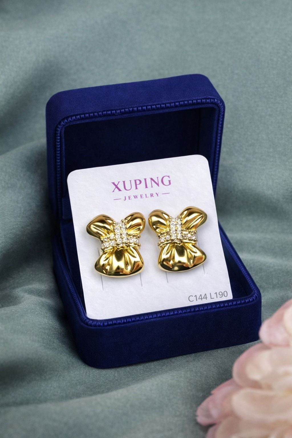 Aritos laminado de oro 18k diseño lazo elegante con zirconias