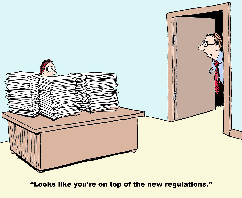 Cartoon image showing man behind many piles of paper and another sating 'Looks like you're on top of the new regulations'