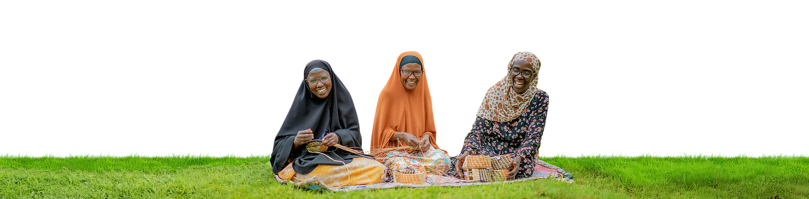 Three happy Uganda textile makers in eyeglasses