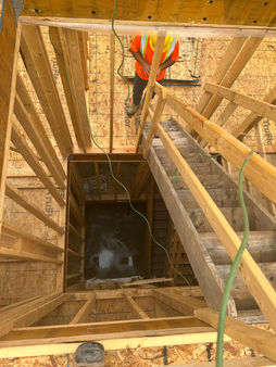 Basement stair framing for legal rental unit conversion in Toronto.